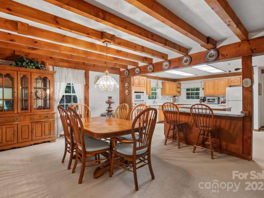 2767 Tanasee Gap Road, Balsam Grove, NC 28708.  MLS# CAR4161160, YatesRealty ID 6567. Kitchen to dining room