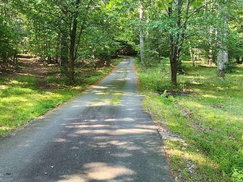 2767 Tanasee Gap Road, Balsam Grove, NC 28708.  MLS# CAR4161160, YatesRealty ID 6567. Long Paved driveway