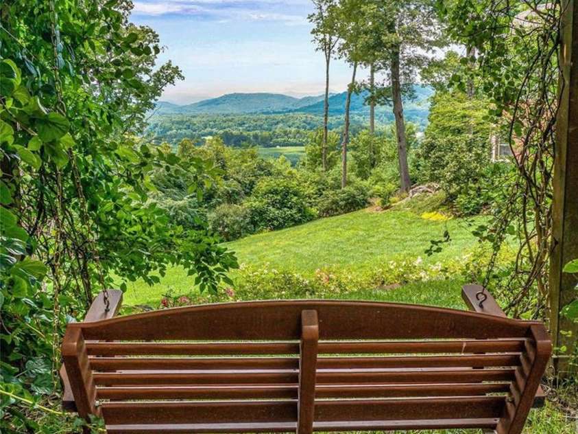 125 Lindsley Court, Hendersonville, NC 28792.  MLS# CAR4245651, YatesRealty ID 6574. Bench with a view in the yard