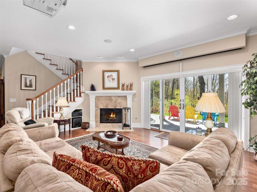 125 Lindsley Court, Hendersonville, NC 28792.  MLS# CAR4245651, YatesRealty ID 6574. Downstairs Family Room with Pull Down Movie Screen