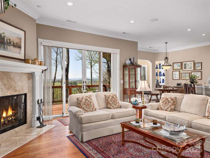 125 Lindsley Court, Hendersonville, NC 28792.  MLS# CAR4245651, YatesRealty ID 6574. Family Room off Kitchen with wood burning fireplace