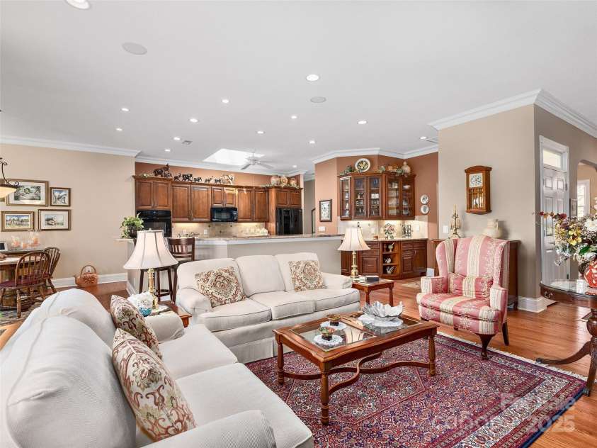 125 Lindsley Court, Hendersonville, NC 28792.  MLS# CAR4245651, YatesRealty ID 6574. Family Room with Kitchen in background