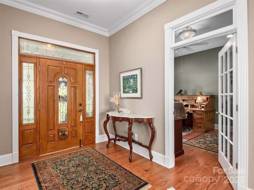 125 Lindsley Court, Hendersonville, NC 28792.  MLS# CAR4245651, YatesRealty ID 6574. Foyer with study to the right and dining room to the left from this angle