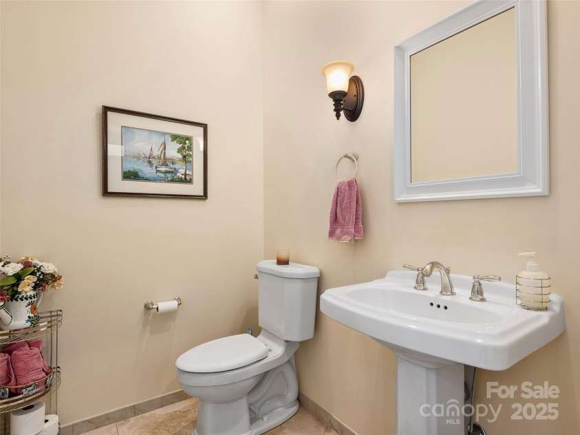 125 Lindsley Court, Hendersonville, NC 28792.  MLS# CAR4245651, YatesRealty ID 6574. Half Bath off Foyer