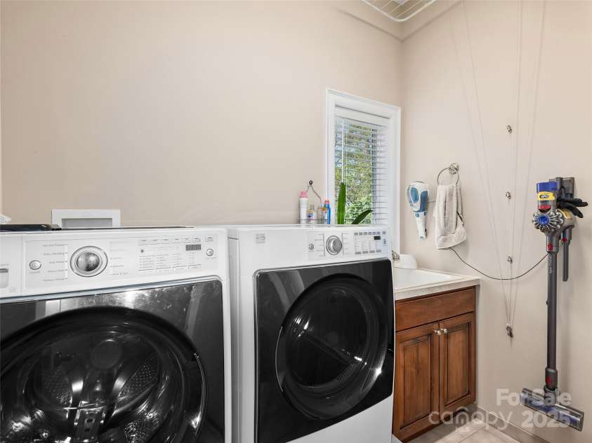 125 Lindsley Court, Hendersonville, NC 28792.  MLS# CAR4245651, YatesRealty ID 6574. Upstairs Laundry Room off Kitchen