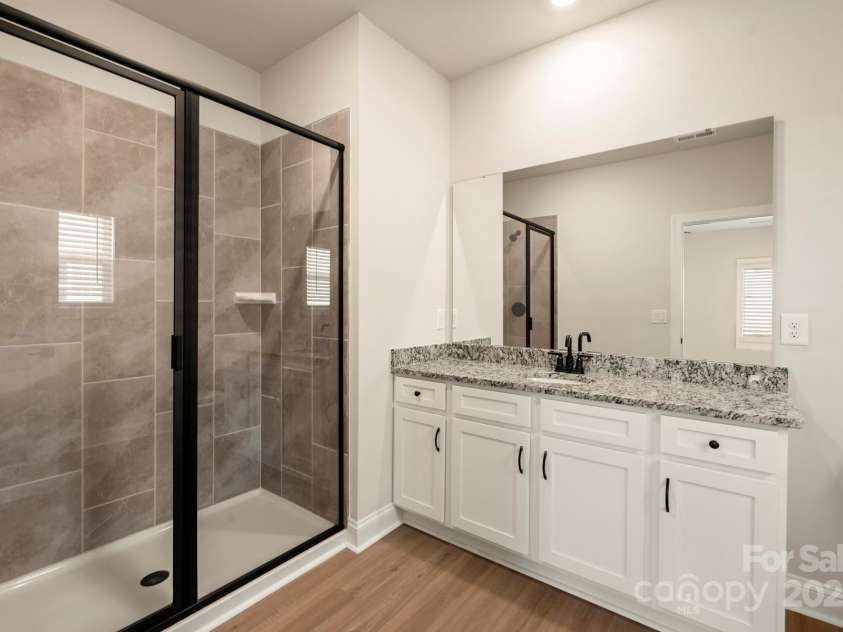 124 Rills Crossing Way, Troutman, NC 28166.  MLS# CAR4334341, YatesRealty ID 6578. Master bathroom
