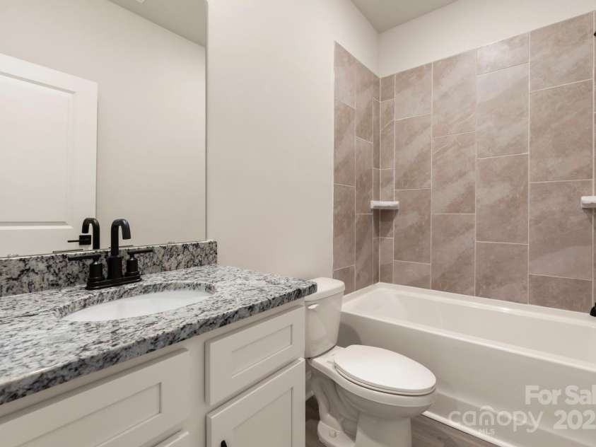 107 Tradesmen Trail, Troutman, NC 28166.  MLS# CAR4334343, YatesRealty ID 6579. Secondary bathroom