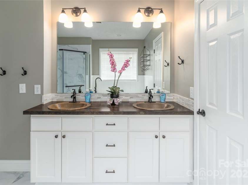 108 Kinderston Drive, Davidson, NC 28036.  MLS# CAR4242010, YatesRealty ID 6579. Dual sink vanity in Primary Bath.