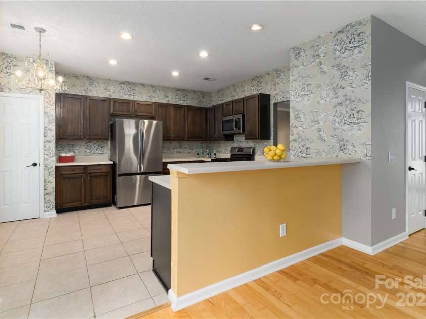 108 Kinderston Drive, Davidson, NC 28036.  MLS# CAR4242010, YatesRealty ID 6579. Kitchen is open to family room.