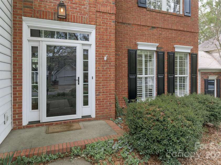 108 Kinderston Drive, Davidson, NC 28036.  MLS# CAR4242010, YatesRealty ID 6579. Storm door at entry.