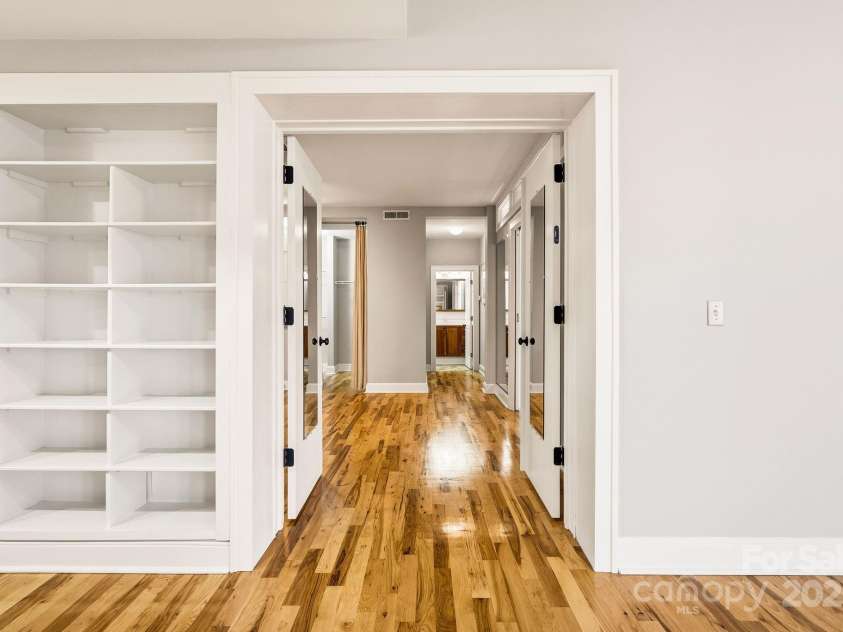 60 Haywood Street, Asheville, NC 28801.  MLS# CAR4317577, YatesRealty ID 659. Doors Open from Living Area to Bedroom Wing 