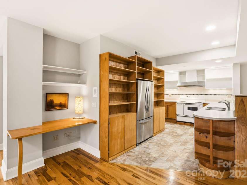 60 Haywood Street, Asheville, NC 28801.  MLS# CAR4317577, YatesRealty ID 659. Living Area Flows to Kitchen