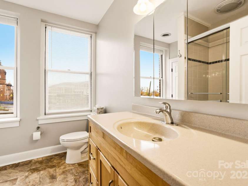 60 Haywood Street, Asheville, NC 28801.  MLS# CAR4317577, YatesRealty ID 659. Second Bathroom has Views of the Iconic Basilica of St Lawrence Church