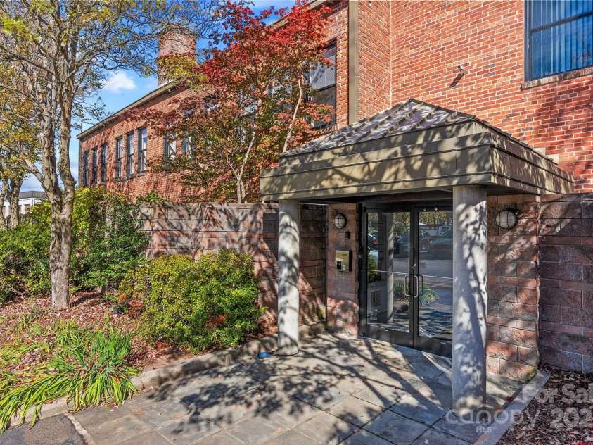 60 Haywood Street, Asheville, NC 28801.  MLS# CAR4317577, YatesRealty ID 659. Welcoming, Covered Entrance off Private Parking Lot