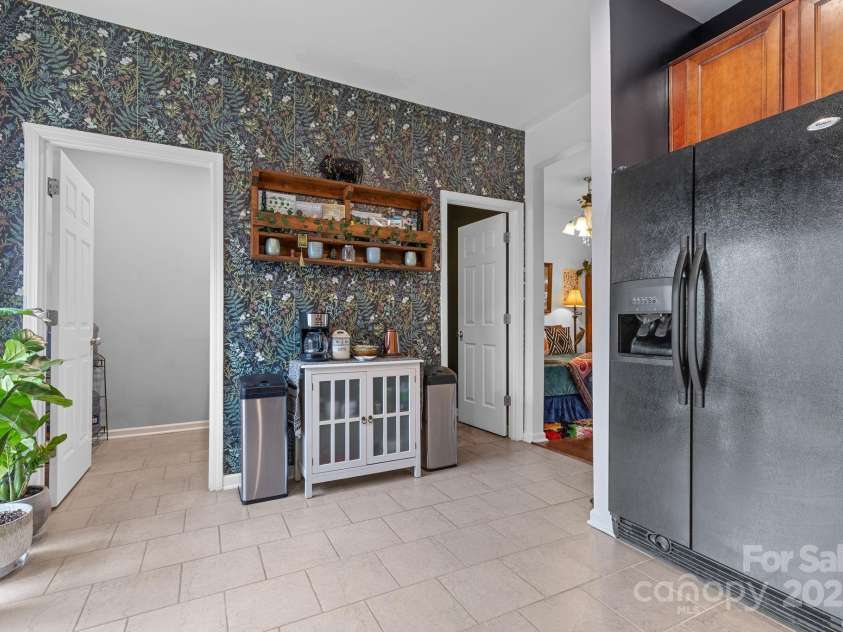 3028 Summerfield Ridge Lane, Matthews, NC 28105.  MLS# CAR4219617, YatesRealty ID 6596. Door on left to laundry, right to half bath. Center, an awesome little coffee station!
