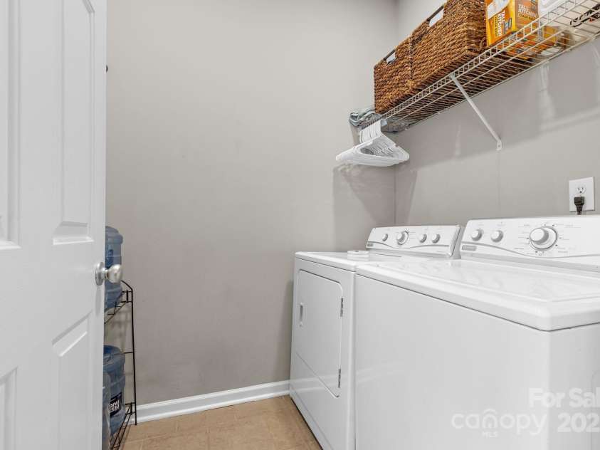 3028 Summerfield Ridge Lane, Matthews, NC 28105.  MLS# CAR4219617, YatesRealty ID 6596. Main level full laundry room