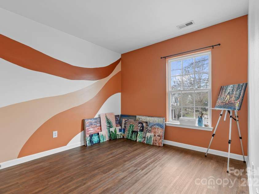 3028 Summerfield Ridge Lane, Matthews, NC 28105.  MLS# CAR4219617, YatesRealty ID 6596. Second bedroom being used as an art studio