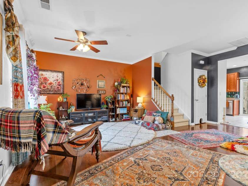 3028 Summerfield Ridge Lane, Matthews, NC 28105.  MLS# CAR4219617, YatesRealty ID 6596. Walk in to a surprisingly large living area, currently boasting eclectic decor!