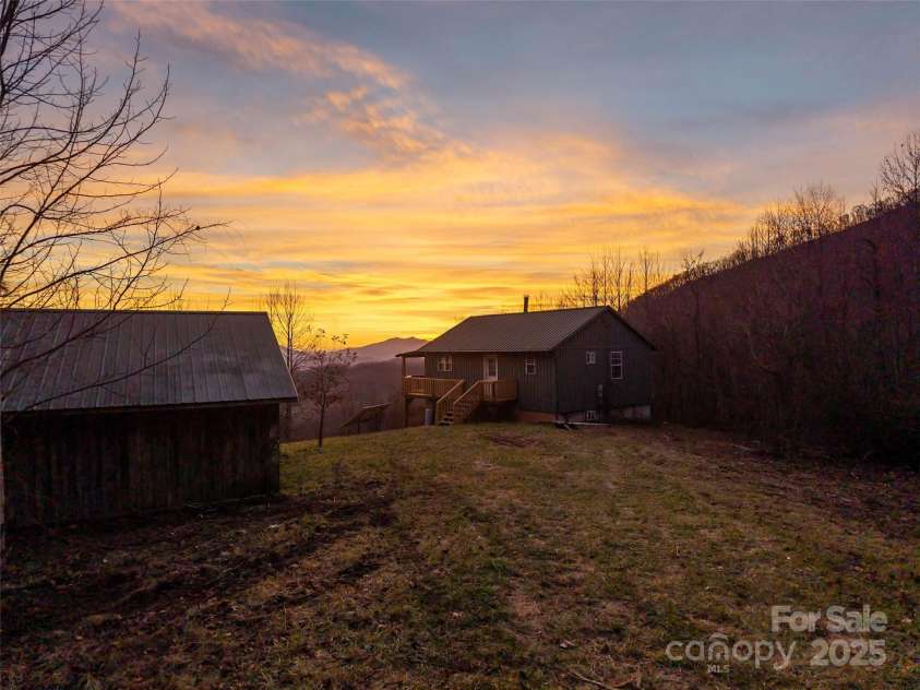 506 Rocky Acres Road, Canton, NC 28716.  MLS# CAR4327605, YatesRealty ID 660. 14 acres with an off grid cabin and 473 sq ft garage/storage shed!