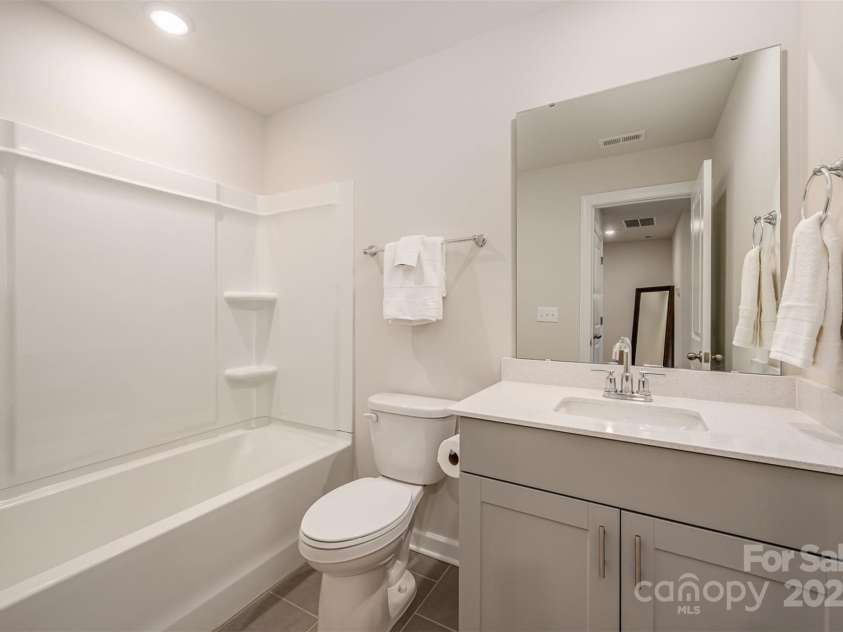 4548 Millennium Avenue, Charlotte, NC 28217.  MLS# CAR4224869, YatesRealty ID 6601. Hall bath
