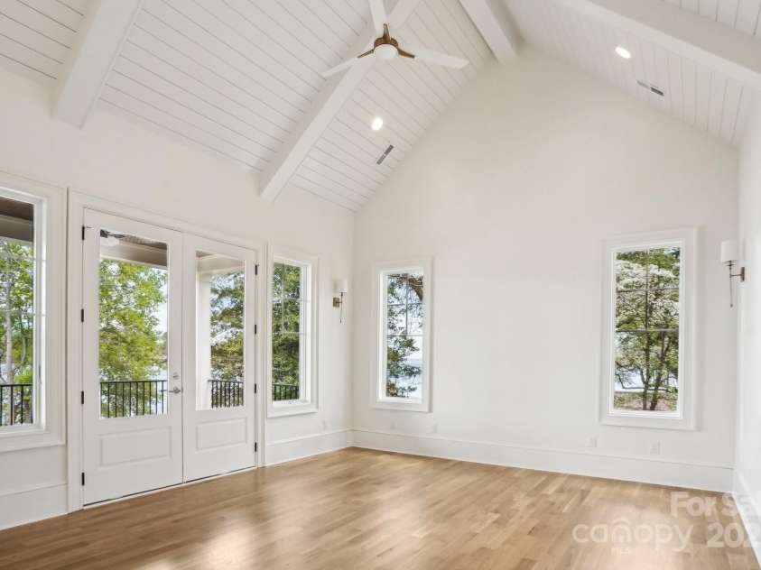 8813 Graham Road, Denver, NC 28037.  MLS# CAR4238880, YatesRealty ID 6603. Empty primary bedroom on the main floor with walk out to the back porch