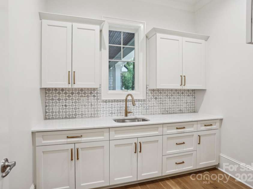 8813 Graham Road, Denver, NC 28037.  MLS# CAR4238880, YatesRealty ID 6603. Laundry room with extra cabinet storage