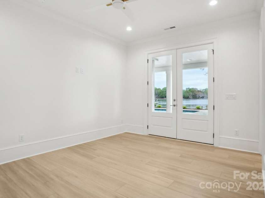 8813 Graham Road, Denver, NC 28037.  MLS# CAR4238880, YatesRealty ID 6603. One of the 2 ensuite bedrooms in the basement with walk out to the pool / lake