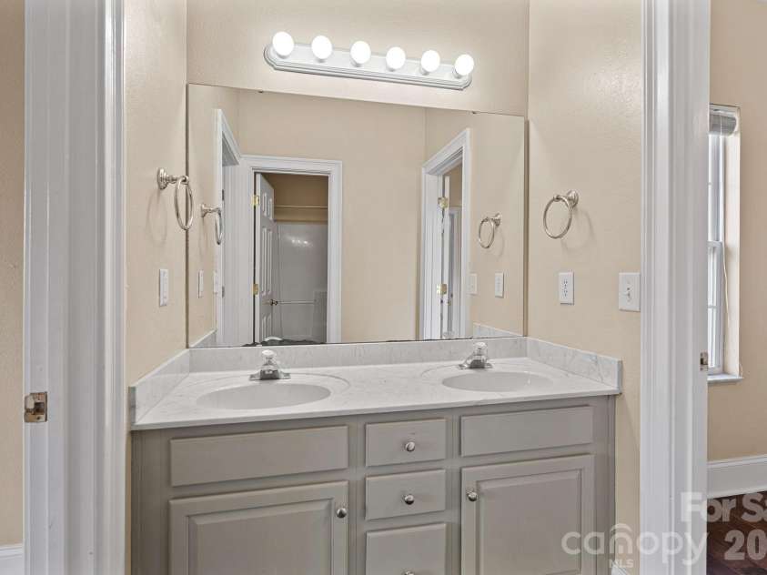 125 Grand Bay Drive, Mooresville, NC 28117.  MLS# CAR4341347, YatesRealty ID 6607. Ensuite Bath between Bedroom and Study