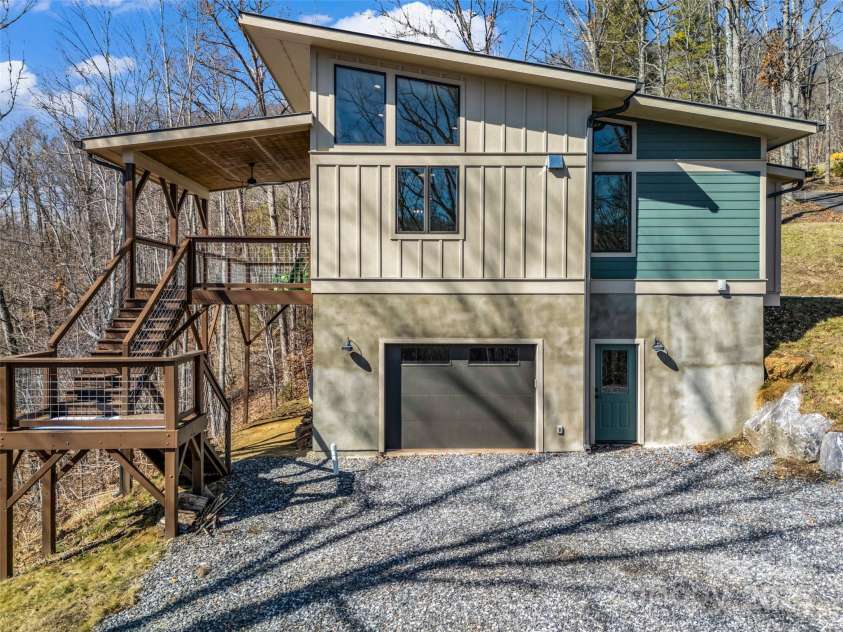 151 Sandys Home Place, Mars Hill, NC 28754.  MLS# CAR4224775, YatesRealty ID 6630. More parking, garage entry and access to both deck levels.