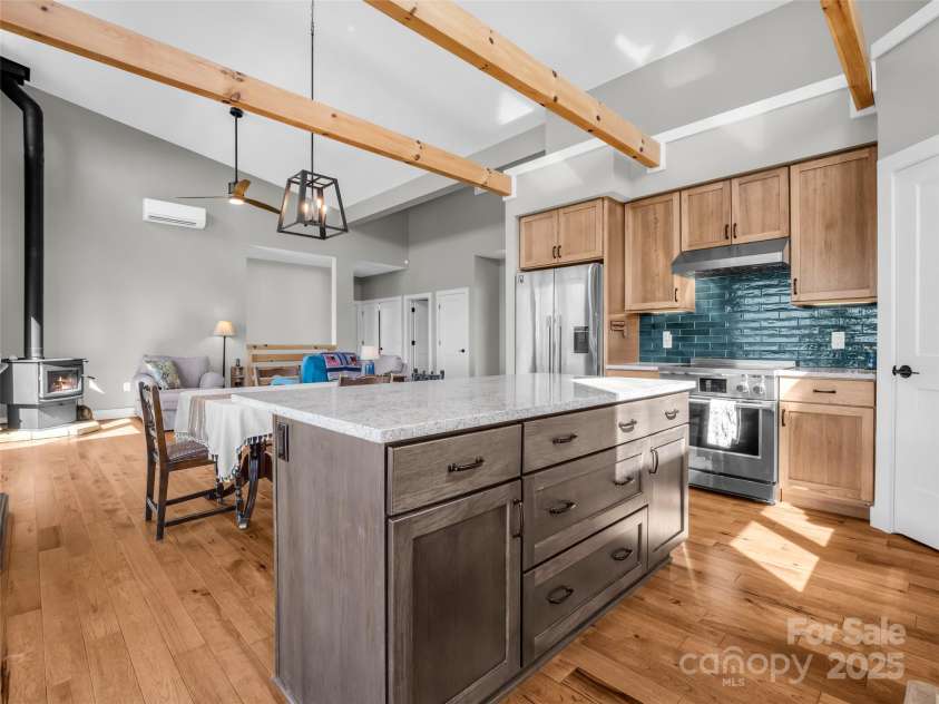 151 Sandys Home Place, Mars Hill, NC 28754.  MLS# CAR4224775, YatesRealty ID 6630. Open concept living from kitchen with beautiful tile backsplash!