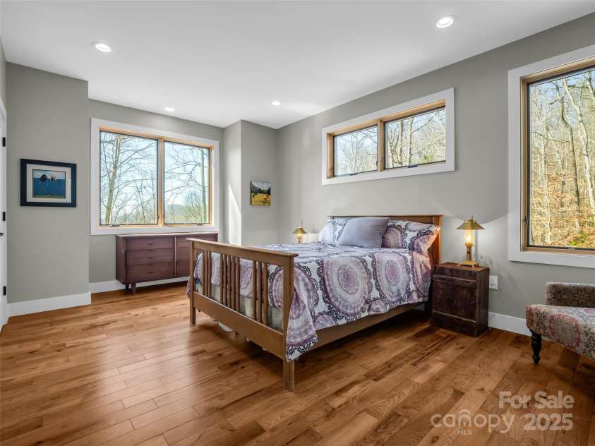 151 Sandys Home Place, Mars Hill, NC 28754.  MLS# CAR4224775, YatesRealty ID 6630. Primary bedroom: enjoy the spectacular view while sipping coffee in bed!