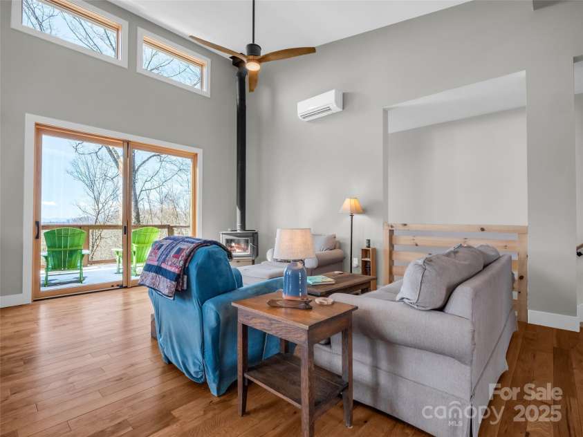 151 Sandys Home Place, Mars Hill, NC 28754.  MLS# CAR4224775, YatesRealty ID 6630. Vaulted ceilings and cozy wood stove.