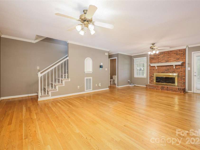 2804 Lake Hill Court, High Point, NC 27265.  MLS# CAR4246605, YatesRealty ID 6635. Livingroom with wood floor and gas logs