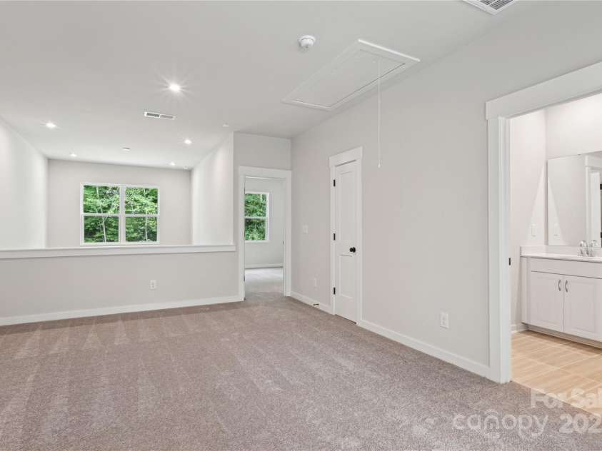 3008 Finchborough Court, Charlotte, NC 28269.  MLS# CAR4239403, YatesRealty ID 6654. *Representative of the Norman floorplan – not the actual home* Spacious loft and second living area overlooking the stunning 2-story great room.