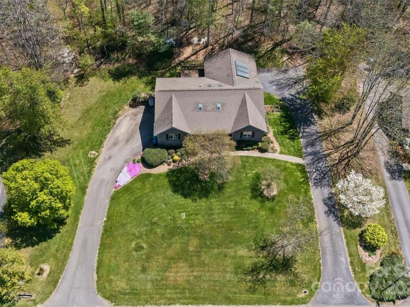 147 Canaan Drive, Candler, NC 28715.  MLS# CAR4248195, YatesRealty ID 6658. Aerial of Property.