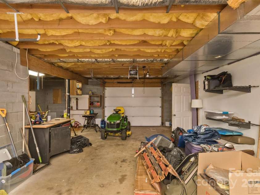 147 Canaan Drive, Candler, NC 28715.  MLS# CAR4248195, YatesRealty ID 6658. Basement Garage.