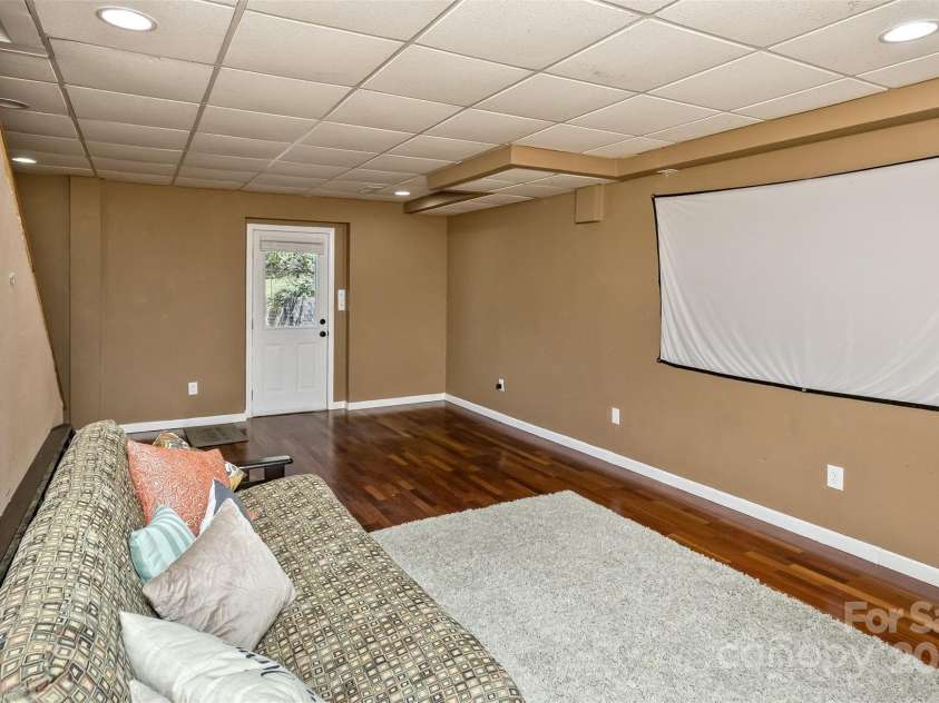 147 Canaan Drive, Candler, NC 28715.  MLS# CAR4248195, YatesRealty ID 6658. Basement Rec. Room.