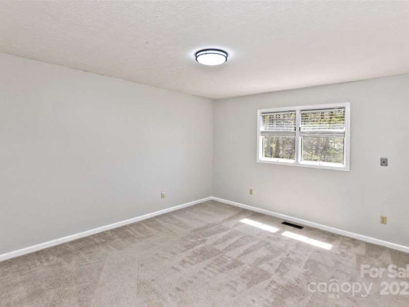 147 Canaan Drive, Candler, NC 28715.  MLS# CAR4248195, YatesRealty ID 6658. Bedroom Two.