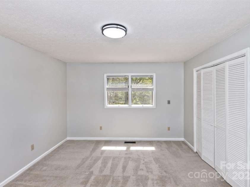 147 Canaan Drive, Candler, NC 28715.  MLS# CAR4248195, YatesRealty ID 6658. Bedroom Two.