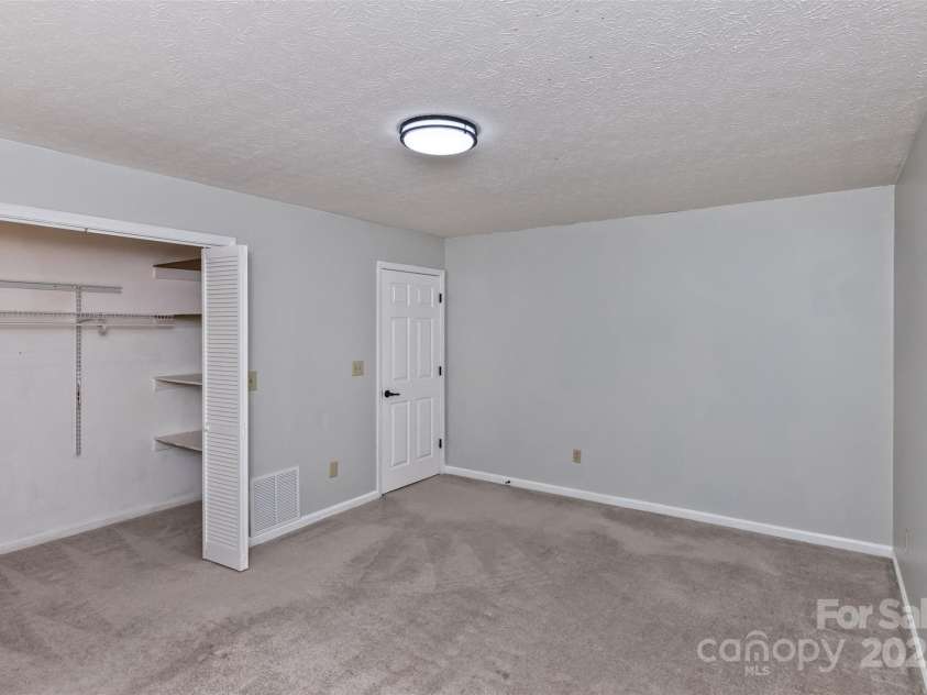 147 Canaan Drive, Candler, NC 28715.  MLS# CAR4248195, YatesRealty ID 6658. Bedroom Two.