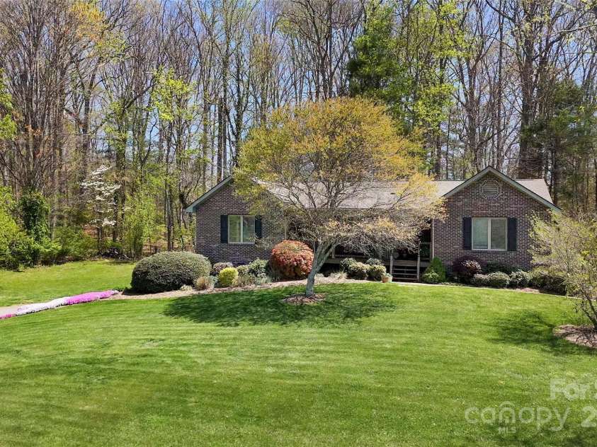 147 Canaan Drive, Candler, NC 28715.  MLS# CAR4248195, YatesRealty ID 6658. Front of Home.