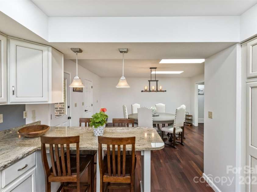 147 Canaan Drive, Candler, NC 28715.  MLS# CAR4248195, YatesRealty ID 6658. Kitchen looking into Dining Room.
