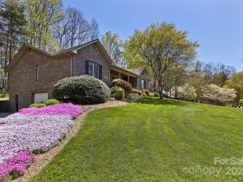 147 Canaan Drive, Candler, NC 28715.  MLS# CAR4248195, YatesRealty ID 6658. Lower Driveway Looking Up.