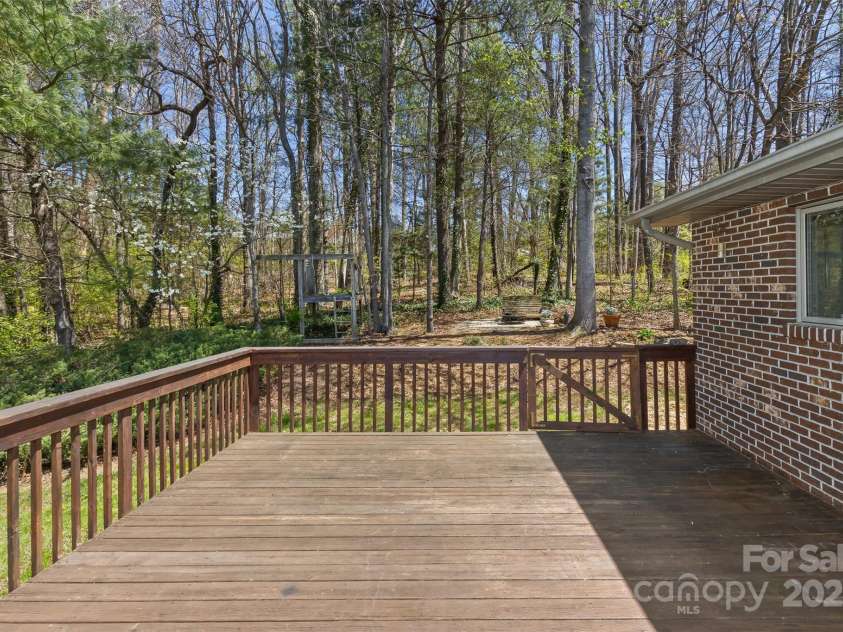 147 Canaan Drive, Candler, NC 28715.  MLS# CAR4248195, YatesRealty ID 6658. Rear Deck.