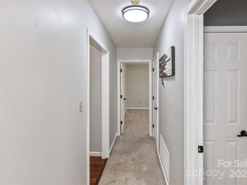 147 Canaan Drive, Candler, NC 28715.  MLS# CAR4248195, YatesRealty ID 6658. Split Bedroom Hallway.