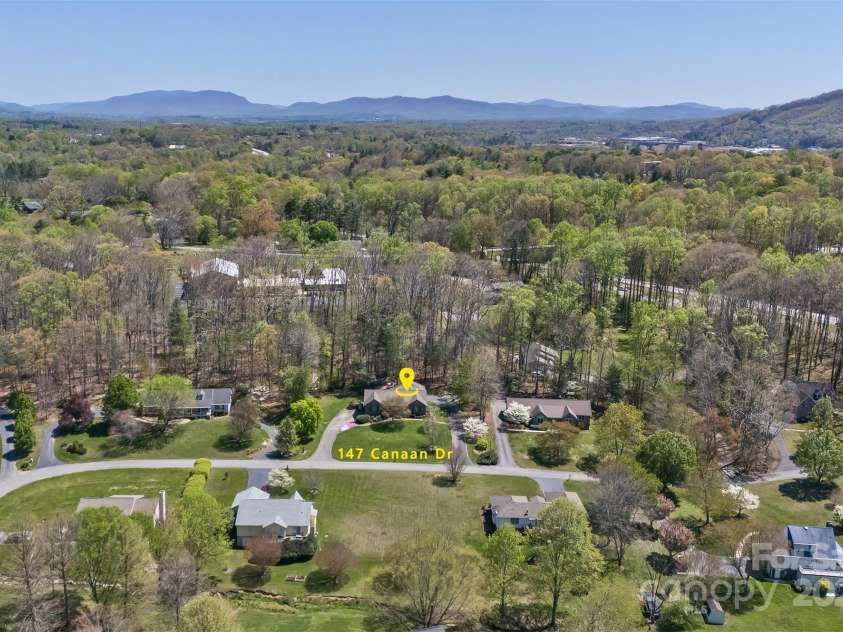 147 Canaan Drive, Candler, NC 28715.  MLS# CAR4248195, YatesRealty ID 6658. Surrounding Mountains.