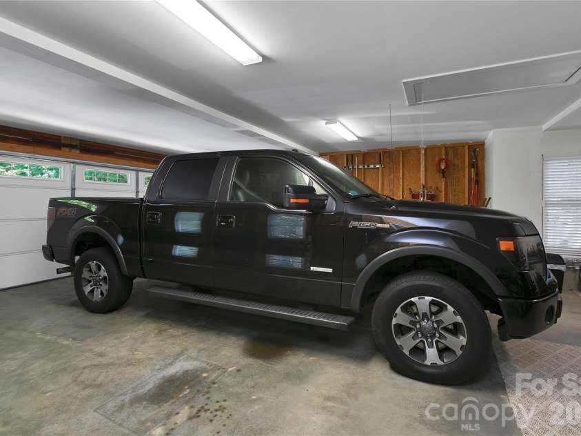 222 Sedi Lane, Brevard, NC 28712.  MLS# CAR4403900, YatesRealty ID 6666. Oversized two car Garage