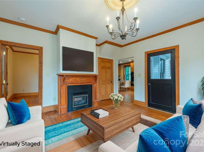 14 Harrison Street, Asheville, NC 28801.  MLS# CAR4181067, YatesRealty ID 6677. Living room very basic and simple-virtually staged