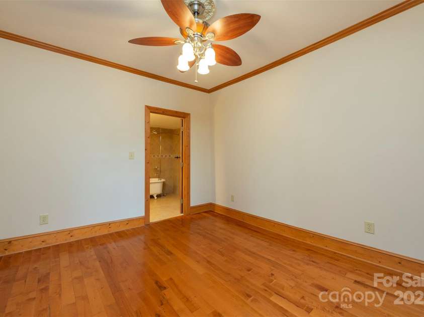 14 Harrison Street, Asheville, NC 28801.  MLS# CAR4181067, YatesRealty ID 6677. Primary bedroom view into full bath