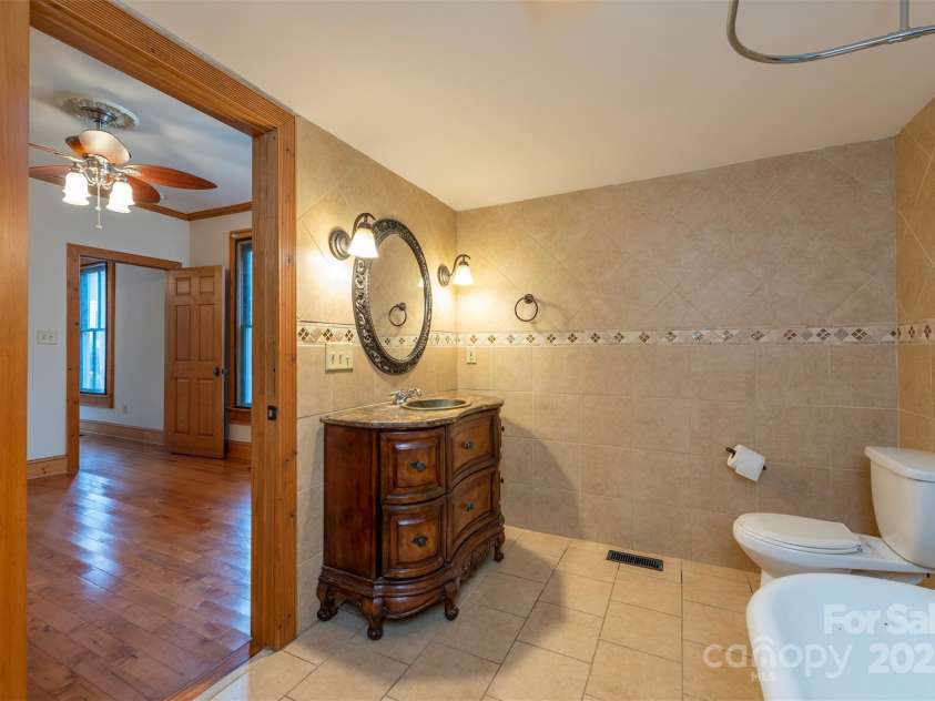 14 Harrison Street, Asheville, NC 28801.  MLS# CAR4181067, YatesRealty ID 6677. Sink and vanity in full bath